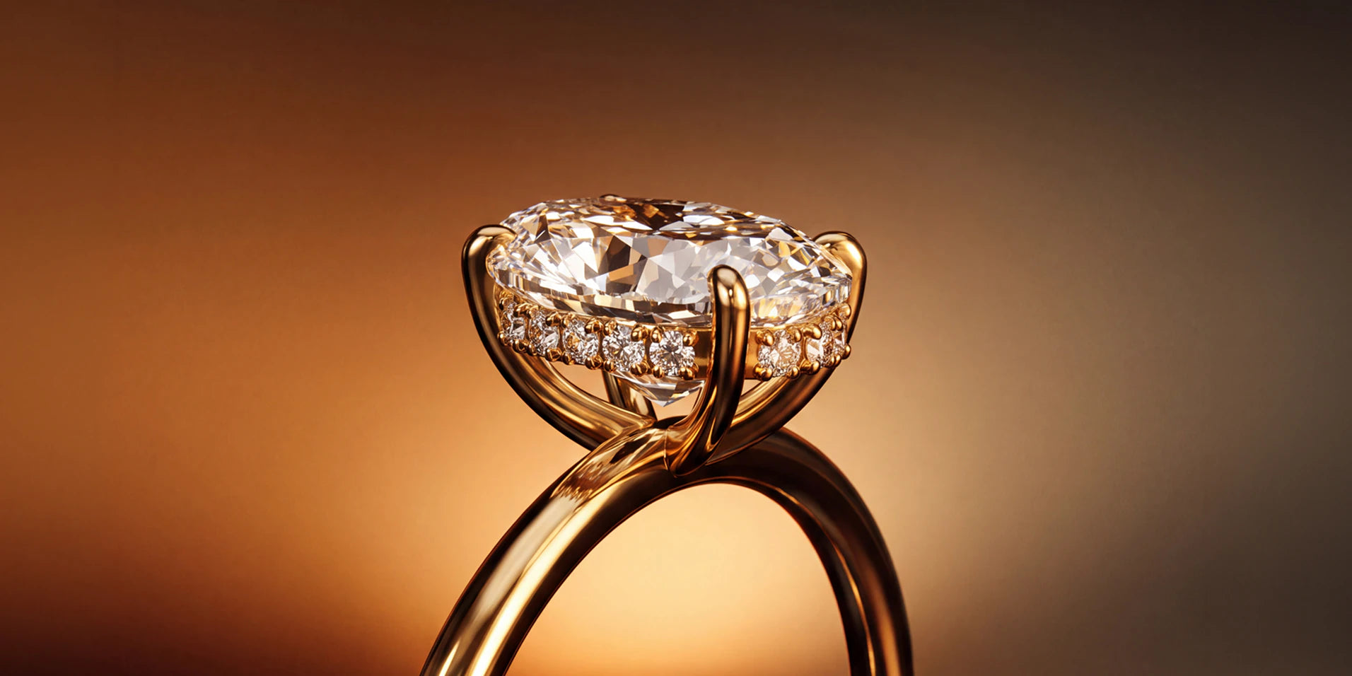 Oval diamond solitaire engagement ring in yellow gold